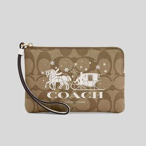 Coach Corner Zip Wristlet In Signature Canvas With Horse And Sleigh